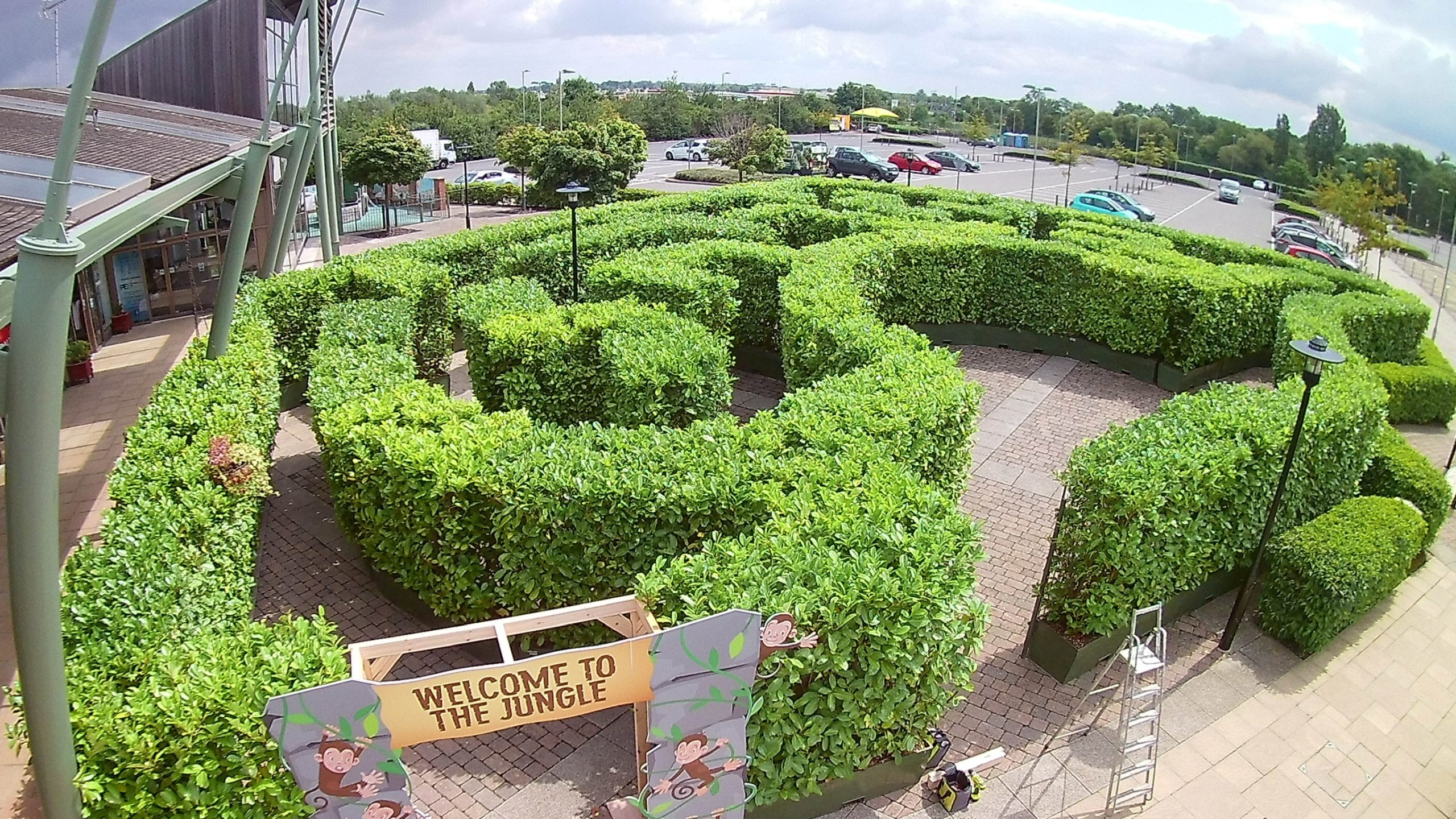 large jungle maze in outdoor carpark
