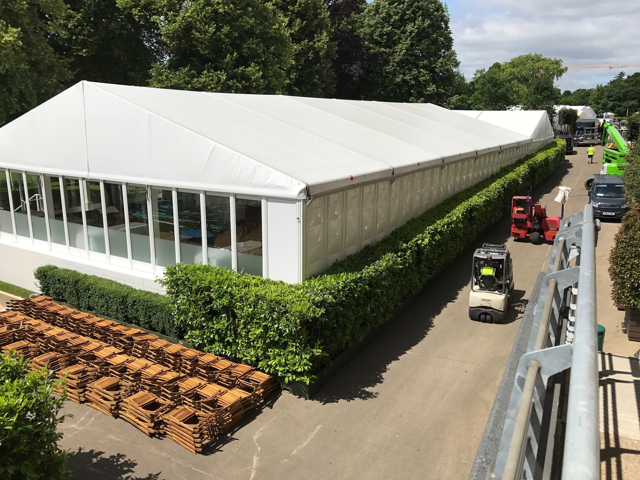 marquee surrounded by hedge wall
